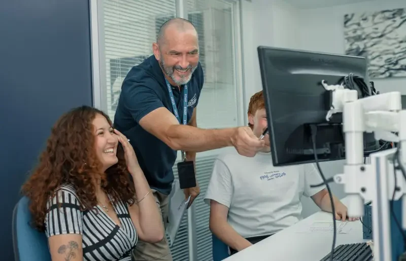 TTMC staff collaborating at a screen